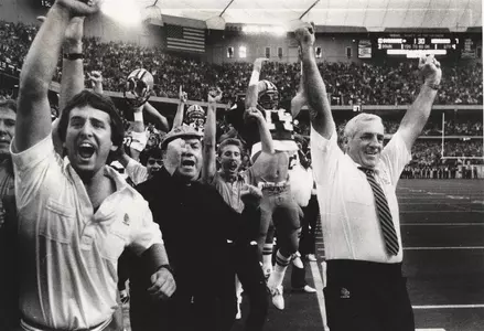 Head coach Dick MacPherson celebrates SU's 1984 win against Nebraska