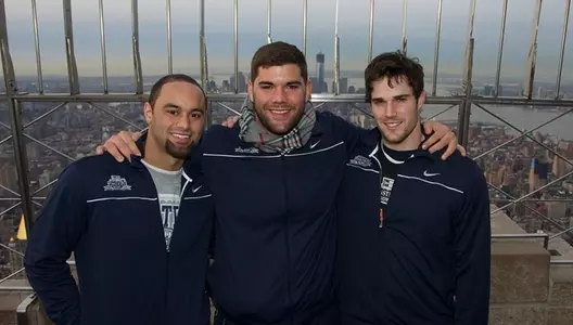 Alec Lemon, Justin Pugh and Charley Loeb pose for a photo on the observation deck of the Empire State Building.