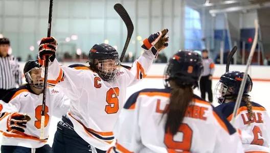 Jacquie Greco raises her arms as she celebrates her first goal on Saturday.