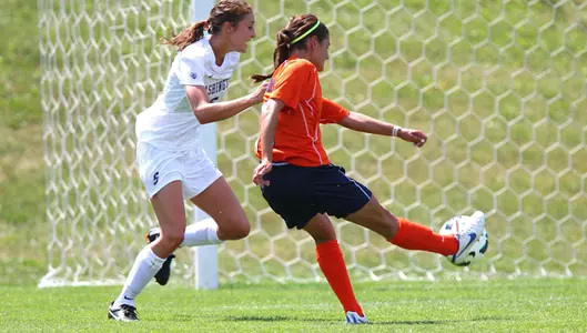 Alexis Koval scores against Washington.