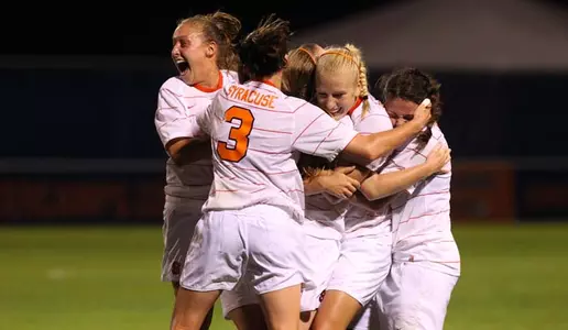 Orange celebrate the game-winning goal against UConn
