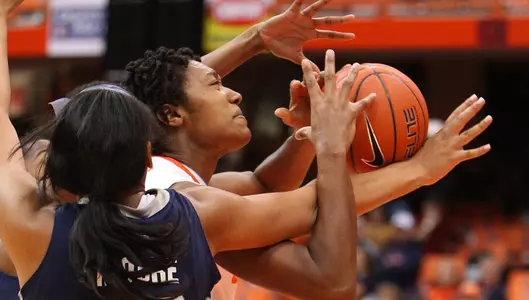 Kayla Alexander tries to muscle her way to the net.