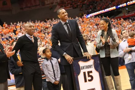 Camelo Anthony with his son, wife and Dr.Daryl Gross as his jersey is retired.