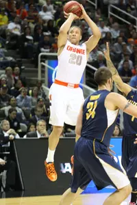 Brandon Triche launches a three point shot.
