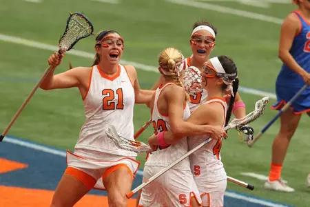 Becca Block celebrates her score with teammates.