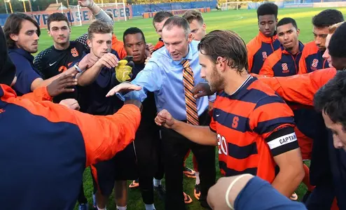 The squad comes together around coach Ian McIntyre prior to the start of Tuesday's game.