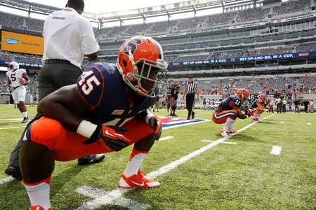 Jerome Smith (45) and the Orange stretch before the game.