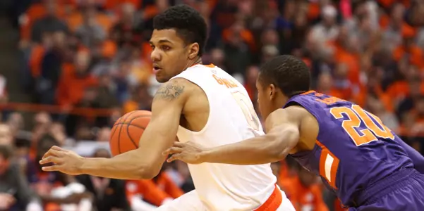 Michael Gbinije takes on Clemson.