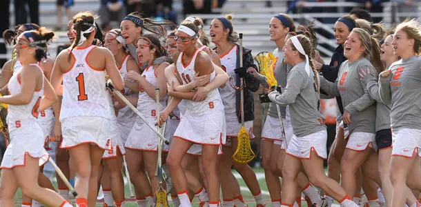 Orange celebrates its win against North Carolina.