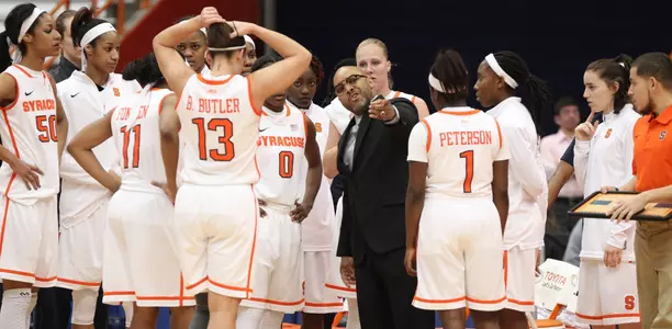Coach Quentin Hillsman instructs the team during a time-out.