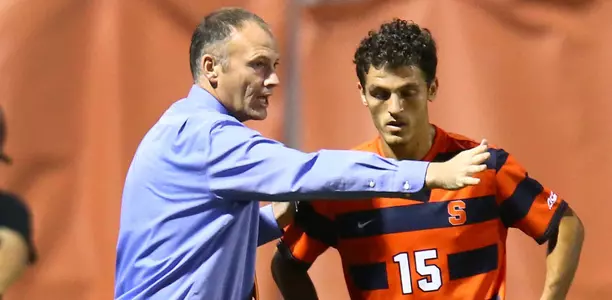 Coach McIntyre gives instruction to Korab Syla.