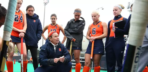 Coach Ange Bradley with the team during a time out.