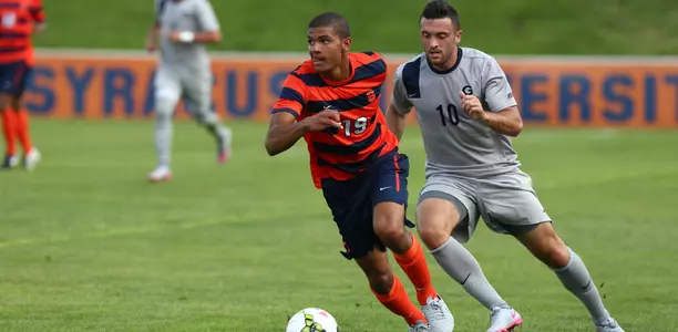 Miles Robinson takes on Georgetown.