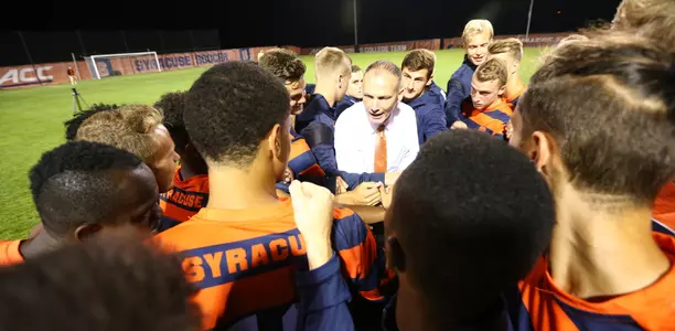 Head coach Ian McIntyre talks to his team after defeating Boston College.