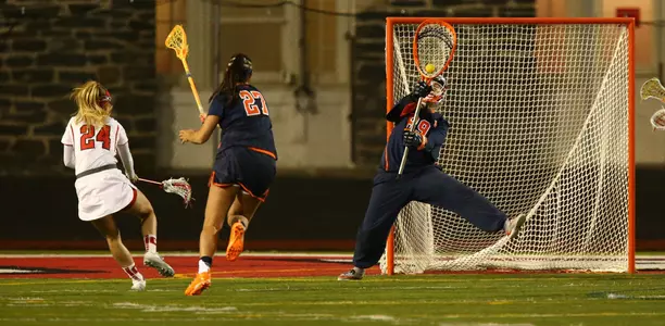 Allie Murray makes one of her five saves at Cornell.