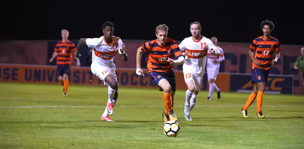 Simon Triantafillou battles Clemson at the SU Soccer Stadium.
