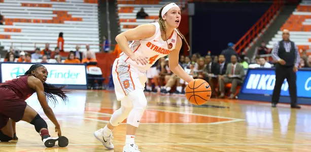 Tiana Mangakahia looks for an open teammate vs. Virginia Tech