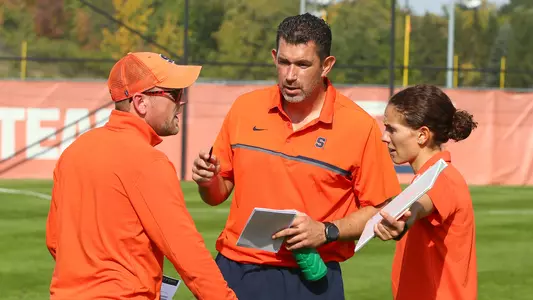 Women's soccer coaches huddle before game