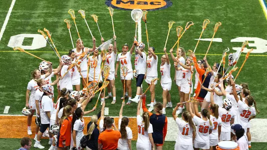 The Orange get ready to take the field.
