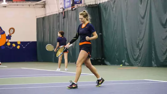 Junior Gabriela Knutson fist pumps after clinching the first singles match for the Orange.