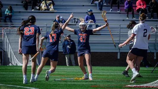 The Orange celebrate a goal against Virginia.