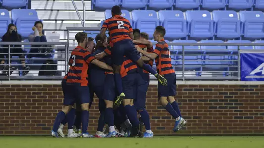 The Orange celebrate their PK shootout victory at North Carolina in the ACC Tournament.