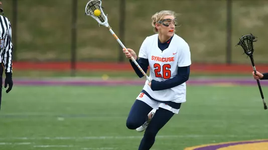 Sarah Cooper works the ball up the field.