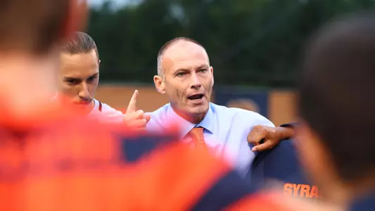 Coach McIntyre talks to his squad before taking on Louisville.