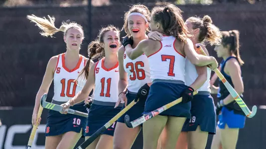 Syracuse hockey celebrates a goal at Duke