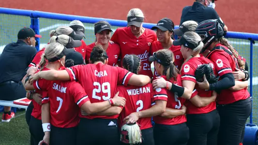 Caira and Team Canada Huddle in Tokyo