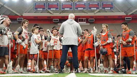 Men's Lacrosse group shot at Alumni Event in Dome