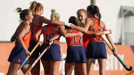 Field Hockey players celebrate a goal against Boston College