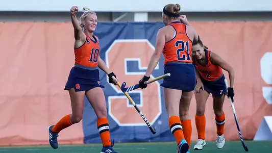 Charlotte de Vries and Eefke van den Nieuwenhof celebrate a goal against Stanford