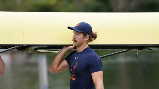 Emmory Sammons carrying shell to boathouse.