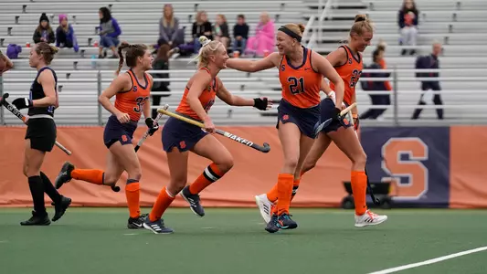 Charlotte de Vries and Eefke van den Nieuwenhof celebrate a goal in the first quarter.