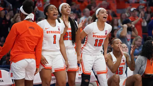WBB Bench celebrates against NC State