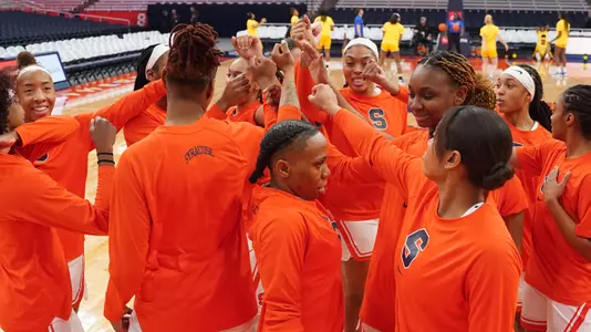 Women's basketball team huddles during warm ups vs. Pittsburgh