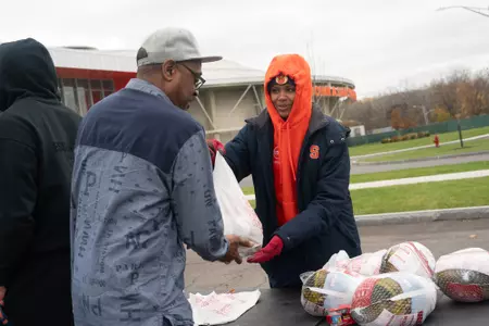 Syracuse student-athletes and staff organized a turkey giveaway for the Syracuse Boys & Girls Club and general Syracuse community.