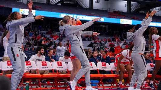 Women's Basketball celebrates during Coppin State win