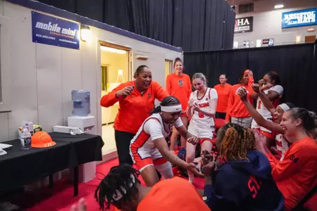Orange team celebrates after beating Iowa State