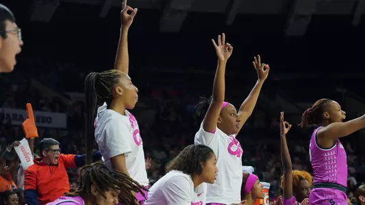 Bench celebrates a three-pointer at Purcell Pavilion
