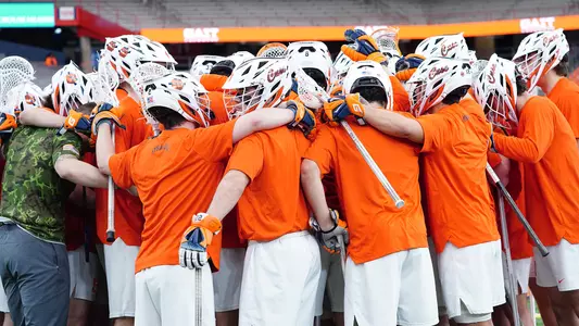 Syracuse men's lacrosse huddle at Holy Cross game