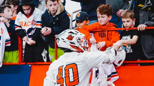Cole Kirst Signs Autographs for Kids postgame
