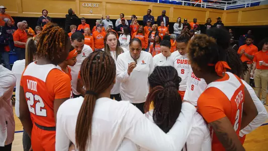 Coach Jack talks to the team during a WNIT game.
