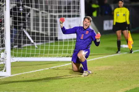 GK Russell Shealy celebrates stopping a penalty kick in route to an NCAA Championship win.