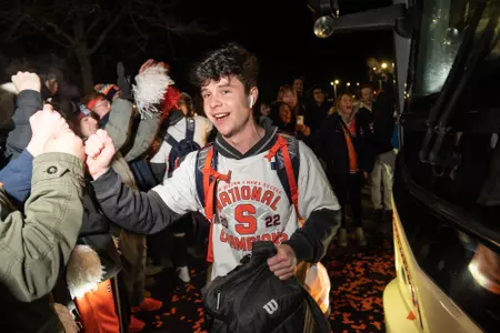 Colin Biros celebrates with the crowd back in Syracuse after winning NCAA Championship