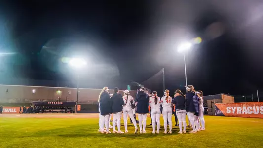 Softball huddles after a game against NC State