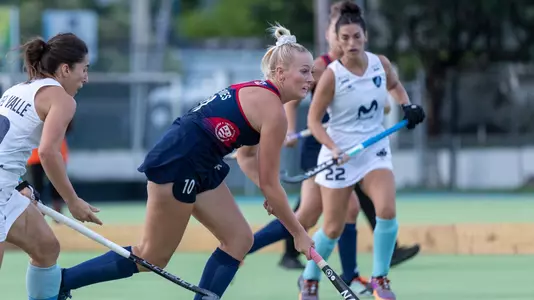 Charlotte de Vries with USWNT wearing an all-blue Team USA Kit