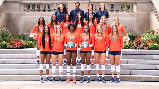 Syracuse volleyball team posed in front of the Hall of Languages on campus