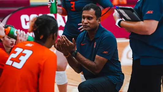 2023 Volleyball Coach Bake Talking in Huddle